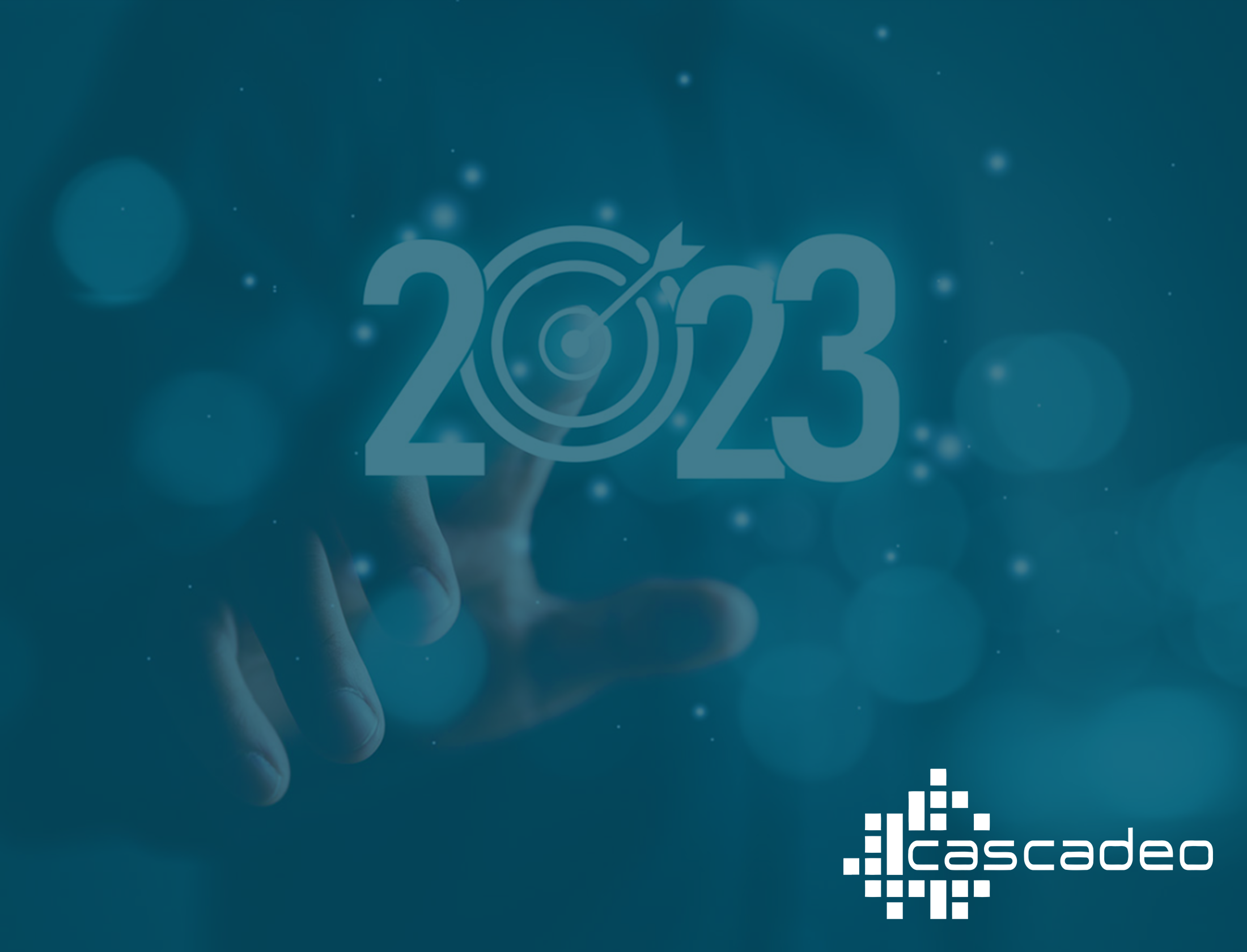 A hand reaches to touch a button with "2023" in the foreground with the Cascadeo logo in the lower right corner.
